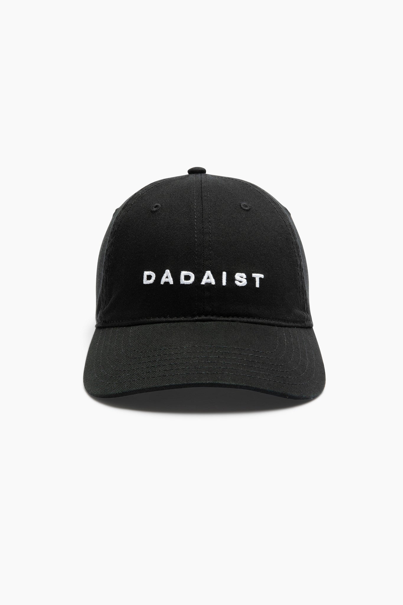 Black cap with 'Dádaist' text on a white background