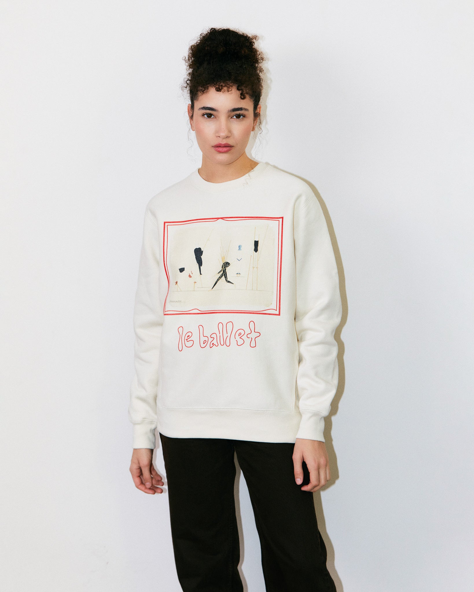 Teodora Marcella wears Cream / Off White / Ceramic Heavyweight Sweatshirt / Crewneck with graphic print of Oskar Schlemmer’s Triadisches Ballet homage to the Bauhaus School. 